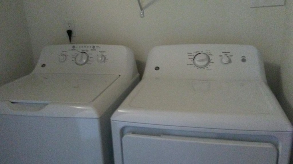 the laundry room has two washes and a dryer
