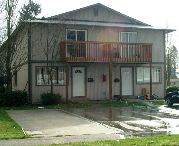A house with a brown deck and a brown door.