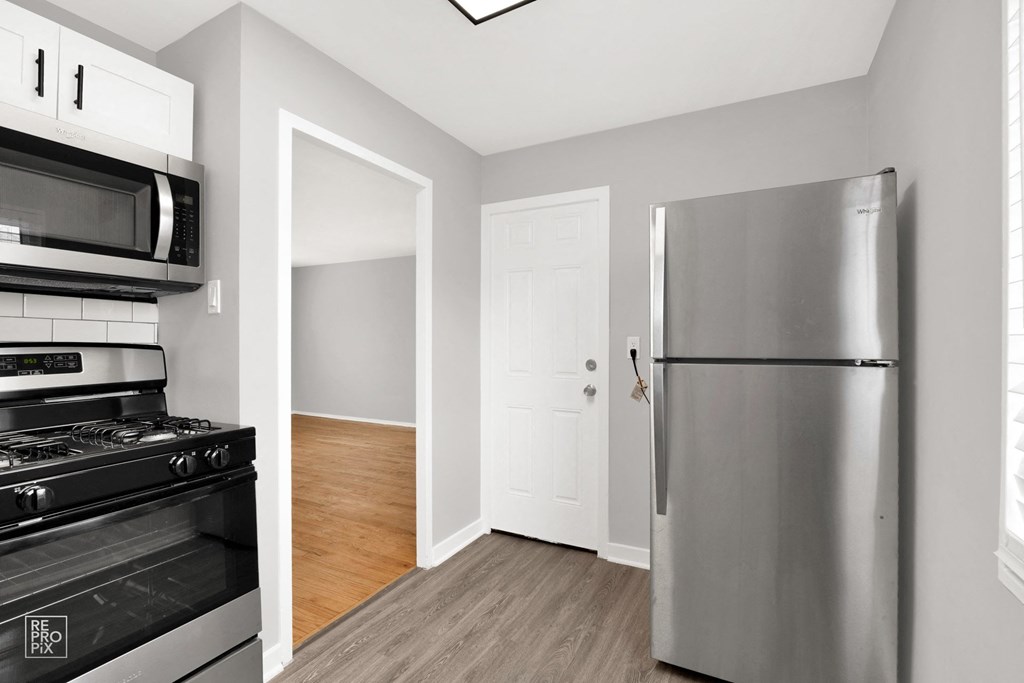 a kitchen and living room in a 555 waverly unit