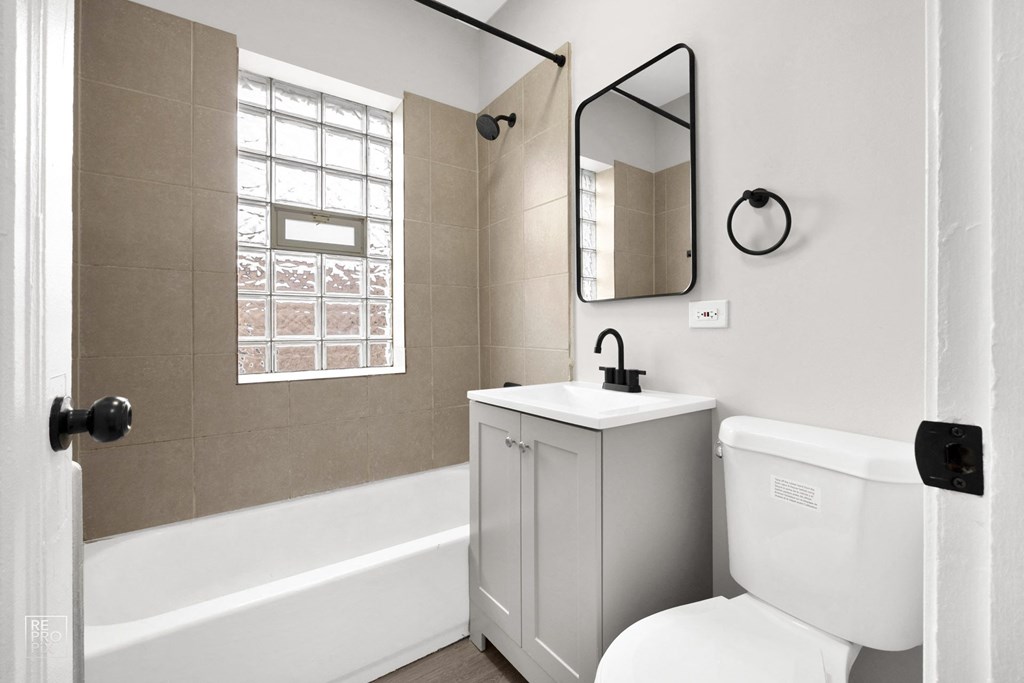 a bathroom with a sink toilet and bathtub