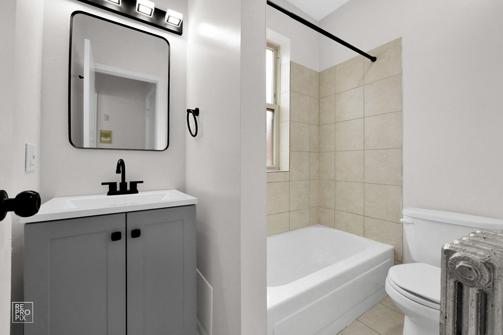 a bathroom with a sink toilet and bathtub