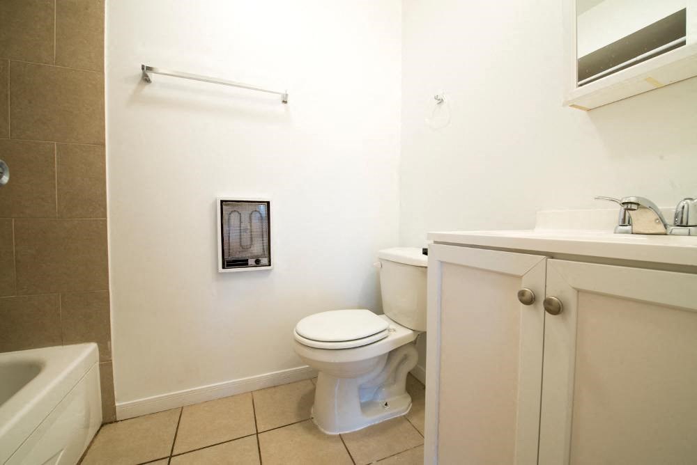 a bathroom with a toilet and a sink