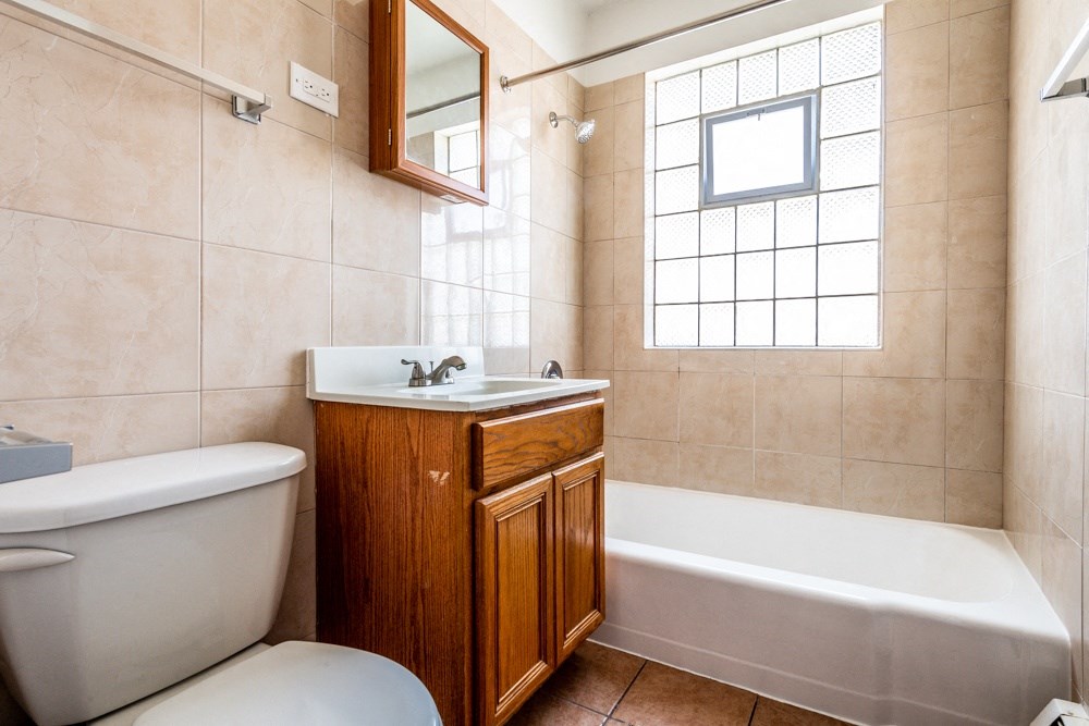 a bathroom with a sink toilet and a bath tub