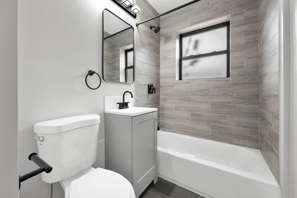 a bathroom with a toilet sink and bathtub