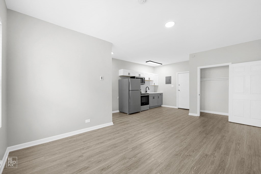 a kitchen and living room in a 555 waverly unit