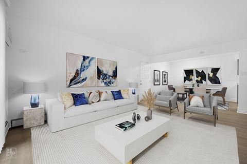 a living room with white walls and a white rug
