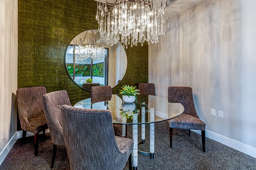 A dining room with a glass table and chairs.at Tiffany Flats, Ohio, 43231