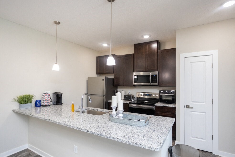 a kitchen with a counter top and a sink