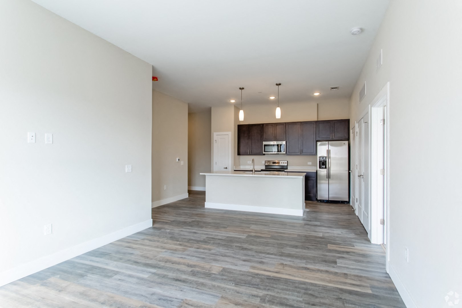 Living room with kitchen at The Flats at Summit Station, South Park