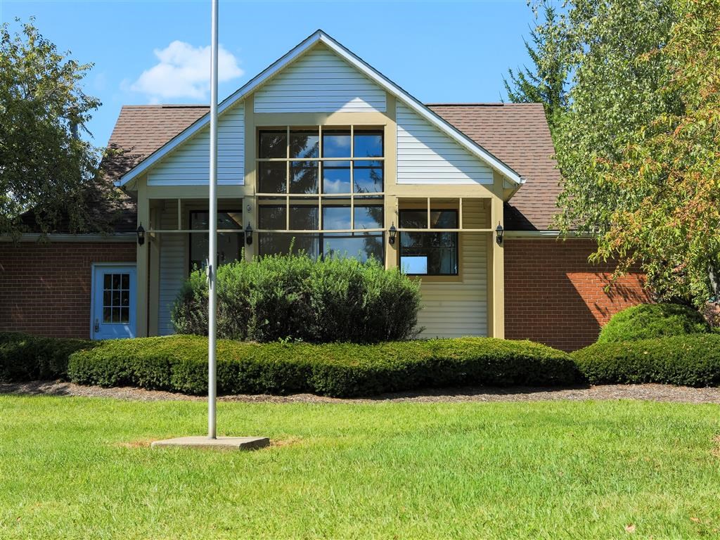 a house with a flag pole in front of it