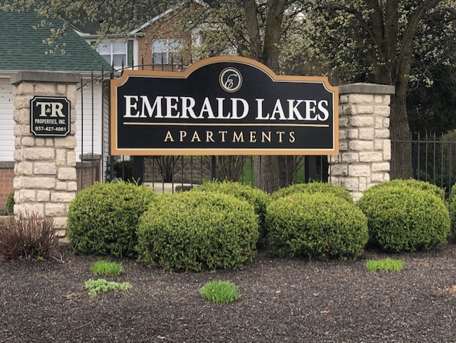 a sign apartments in front of a building