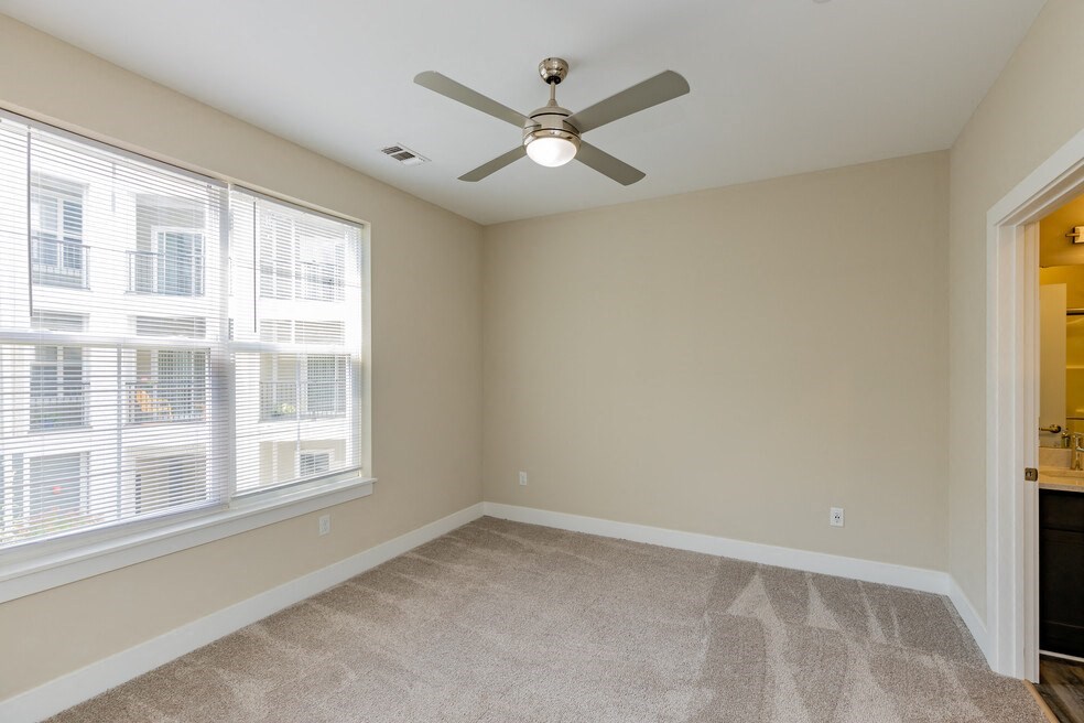 Room with ceiling fan and light at The Flats at Summit Station, South Park, PA