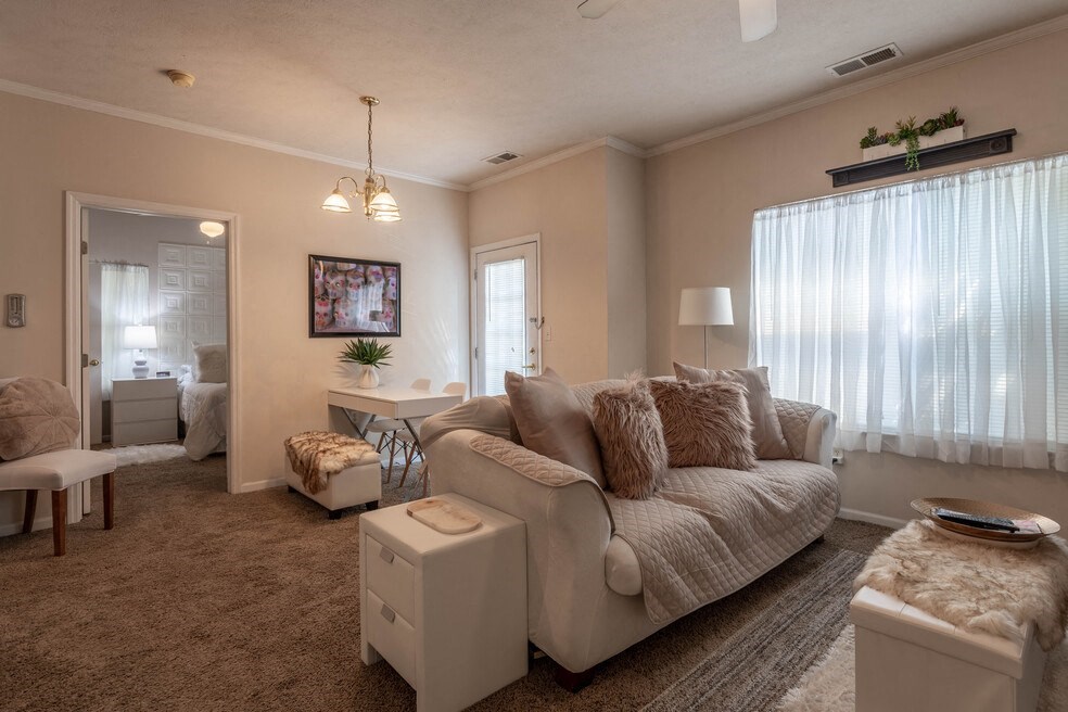 a living room with a couch and a table