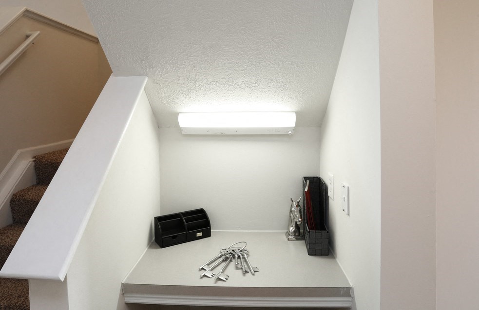 a room with a desk with some tools on it