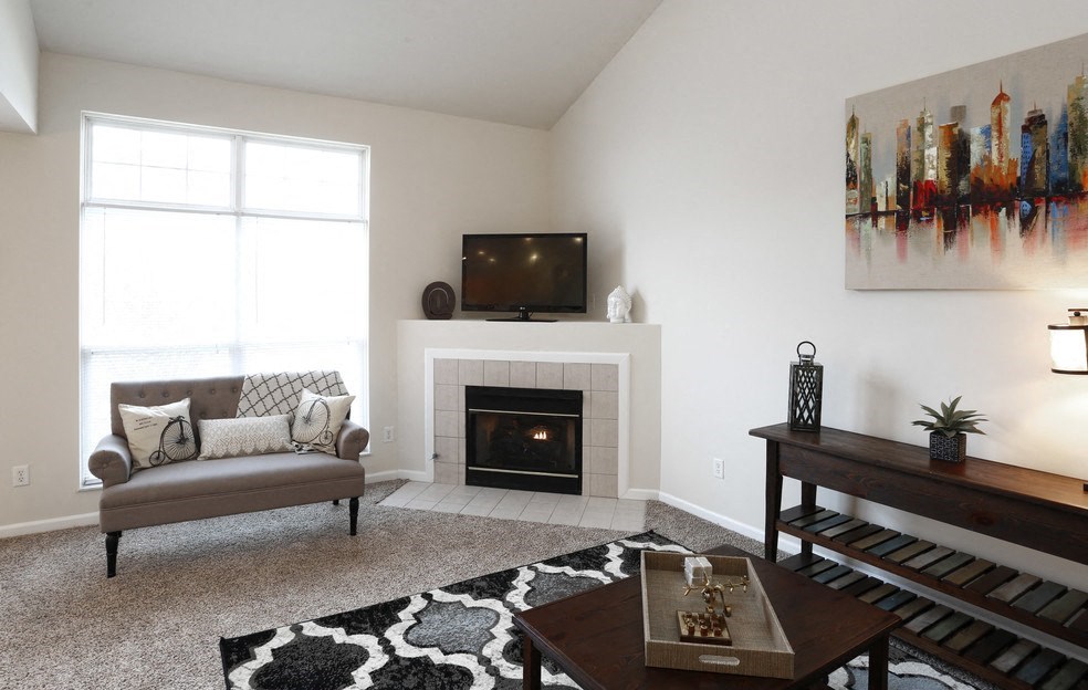 a living room with a couch and a fireplace