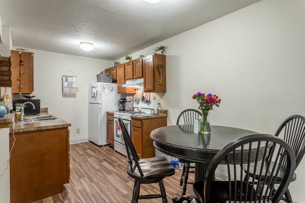 a kitchen and dining room with a table and chairs