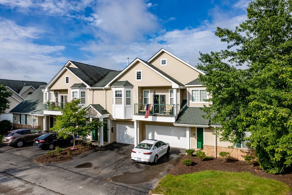 a large house with a car parked in front of it