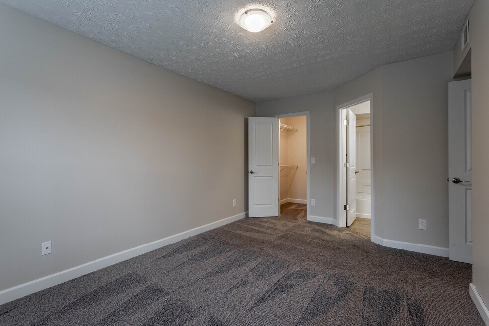 Bedroom with window and wooden floor with ceiling light at Bayside Apartment Homes, Hilliard, 43026