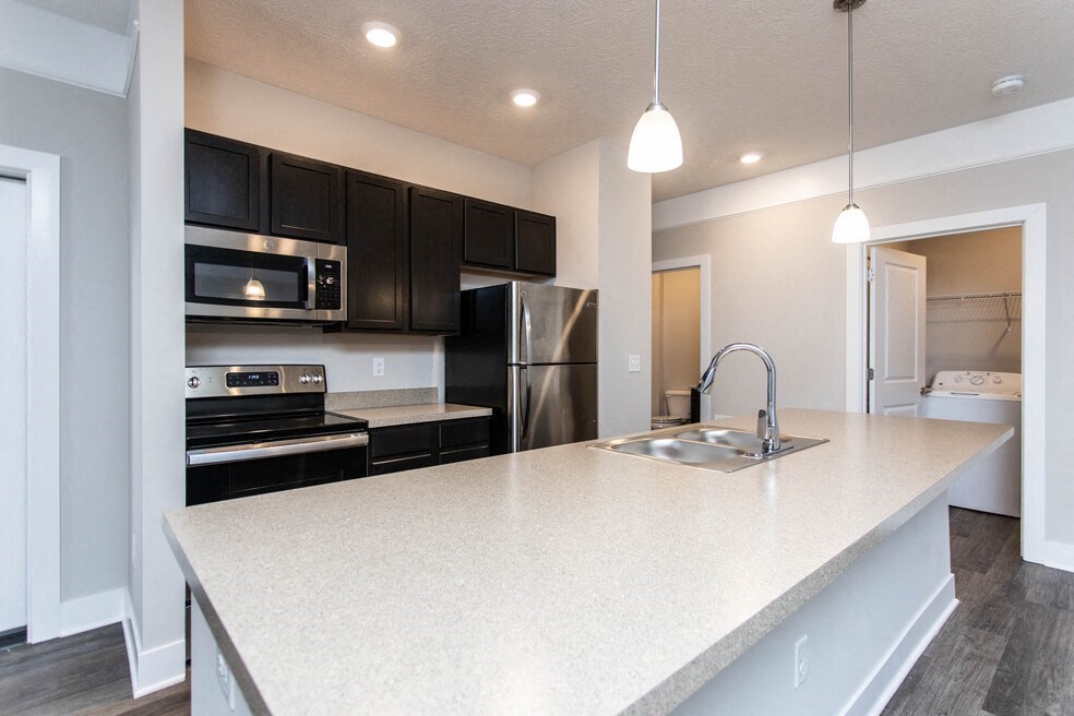 a kitchen with a large counter top and a sink