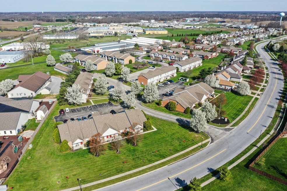 an aerial view of a neighborhood with houses and trees