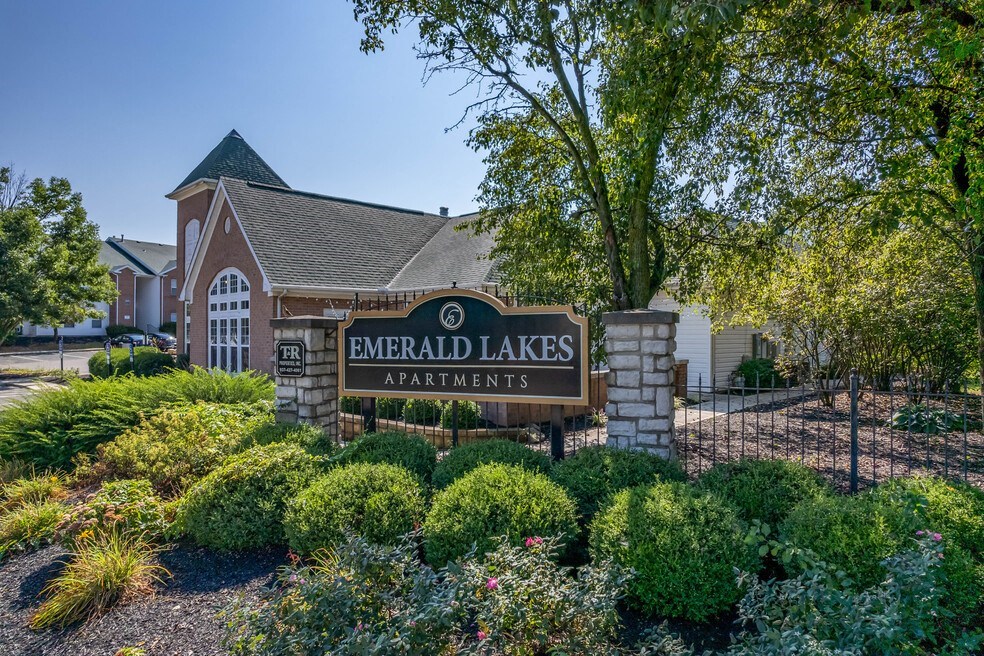 exterior view of emerald lakes apartments sign in front of the building