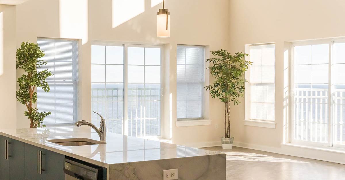 Kitchen counter top and sink with living room water view