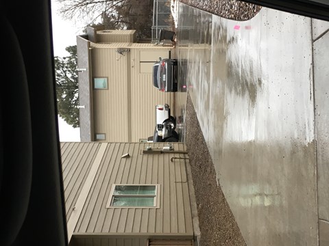 a cat sitting on the roof of a building