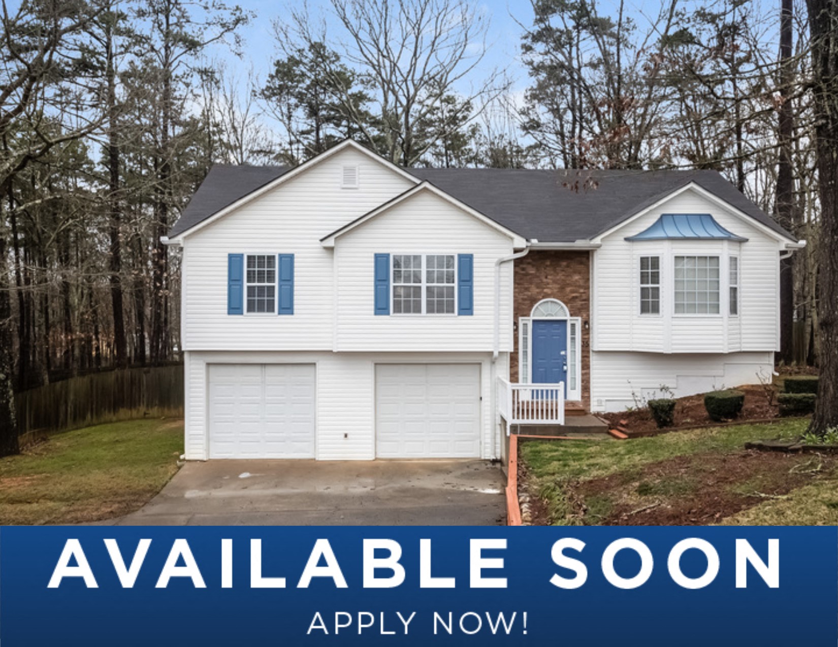 a white house with blue shutters and a blue door