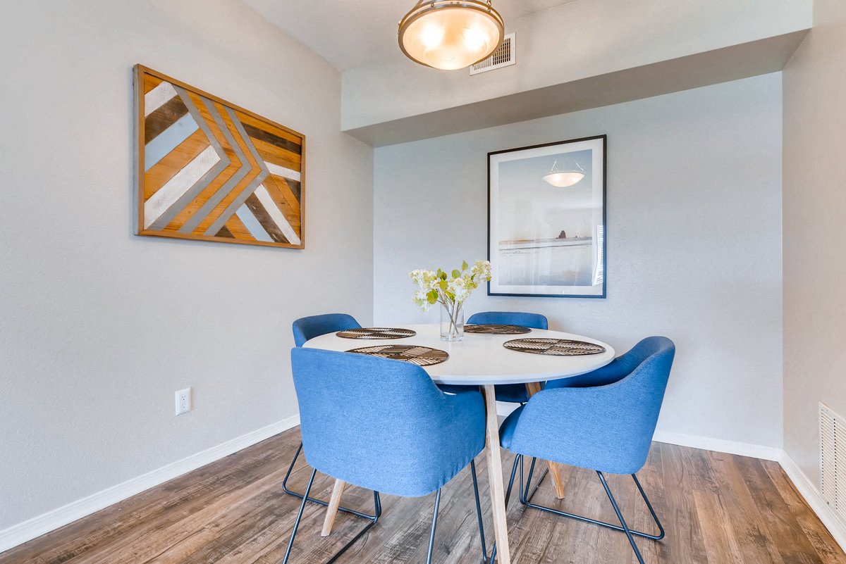 a dining room with a table and chairs