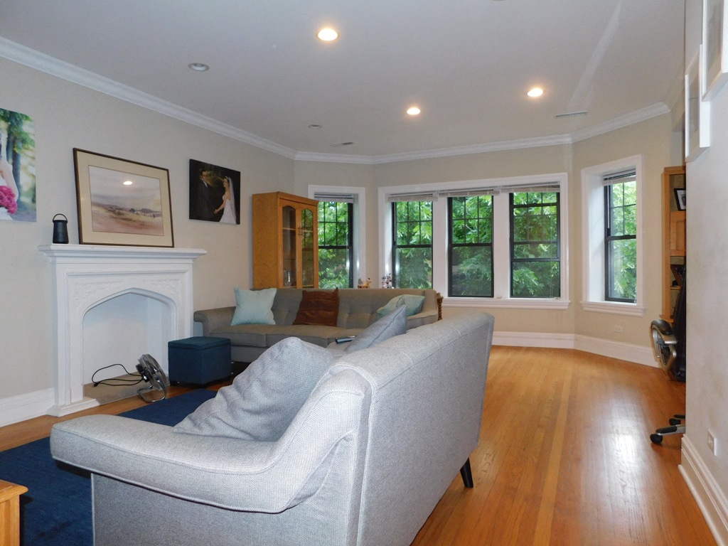 a living room with a couch and a fireplace