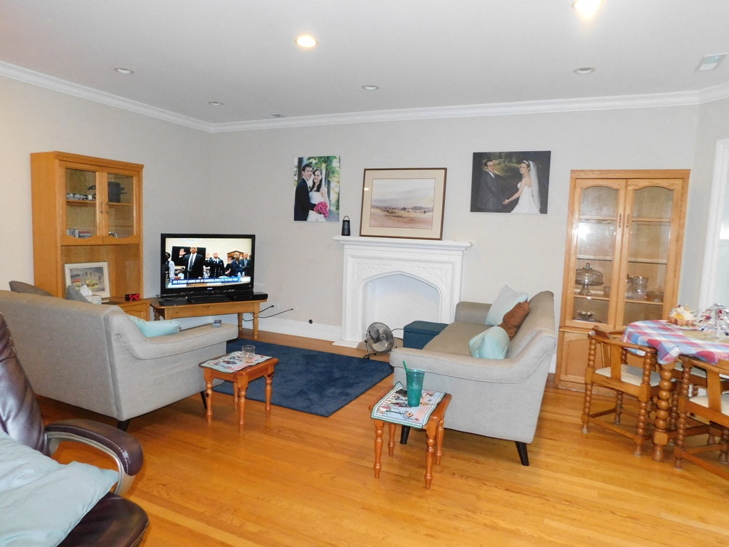 a living room with couches and a tv