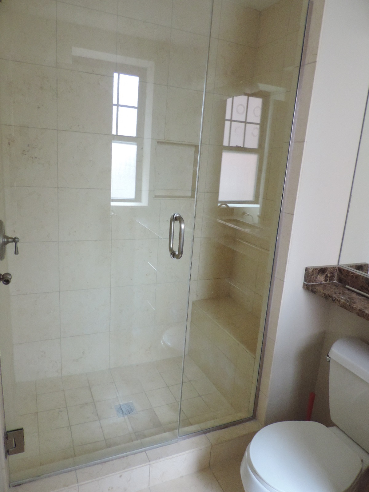 a bathroom with a shower and a toilet