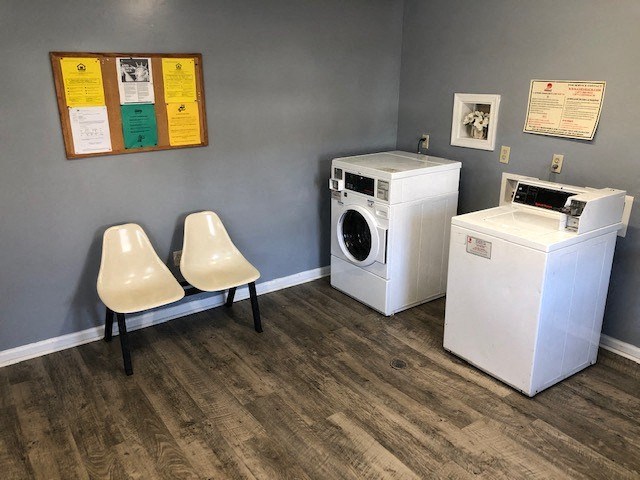 a laundry room with two washes and a washing machine