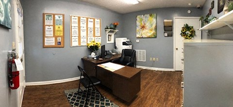 a home office with a desk and a computer