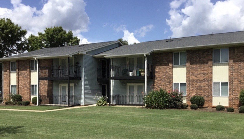 our apartments are located in a complex with balconies and green grass