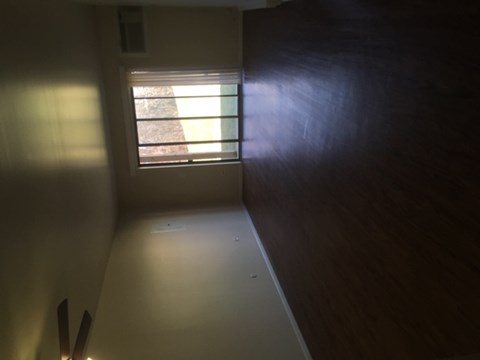 an empty room in a house with a window