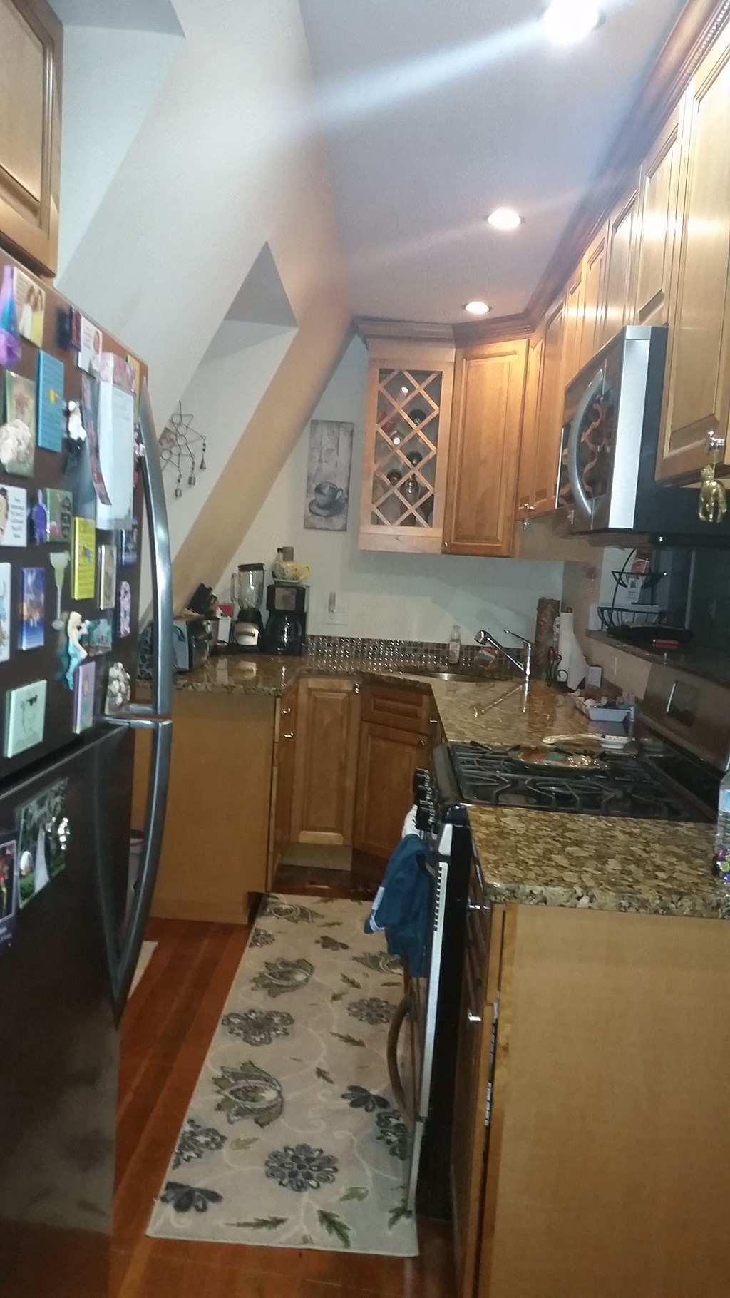 a kitchen with a counter top and a refrigerator