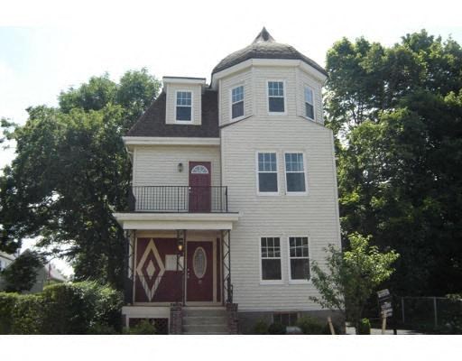 a white house with a tower on top of it