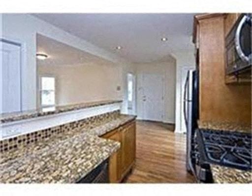 a kitchen with a counter top and a refrigerator