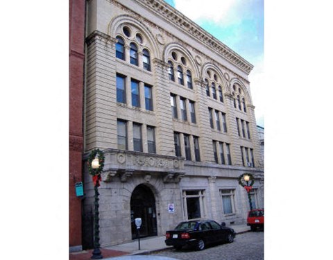 a large building on the corner of a city street