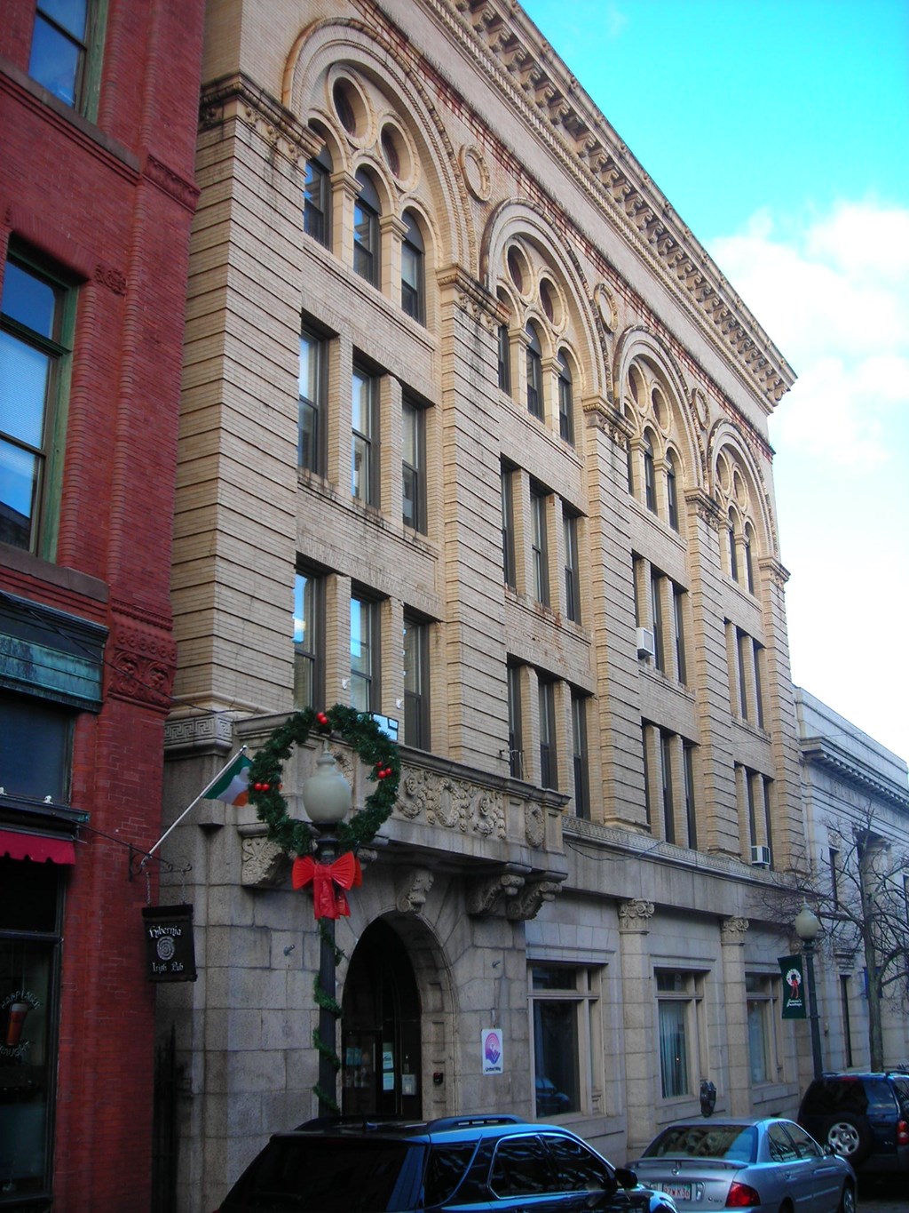 a large building with a wreath on the front of it