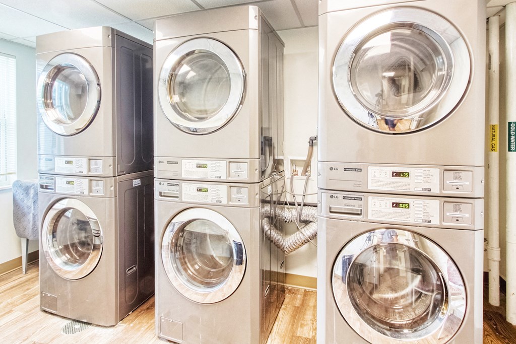 laundry room with stacked washers and dryers