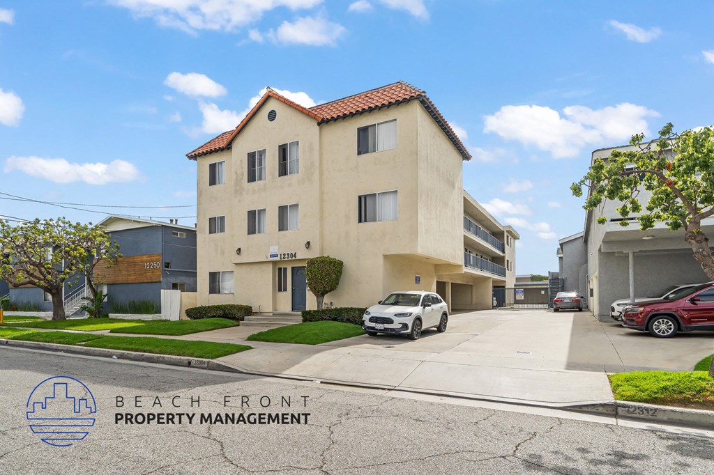 A building with the words "Beach Front Property Management" on the bottom left corner.