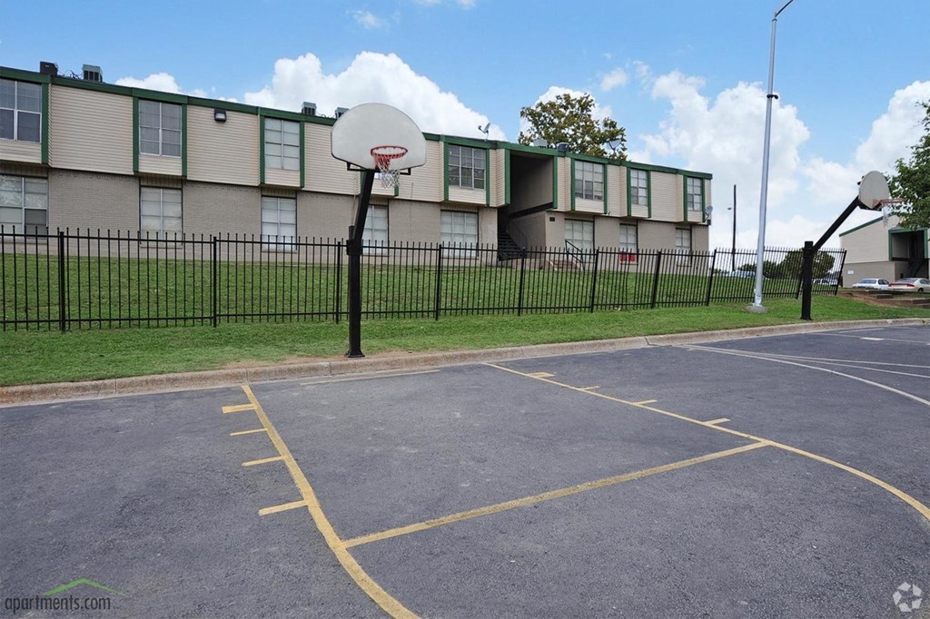 a basketball court in front of a building