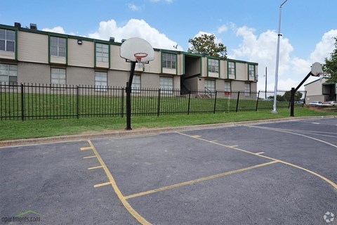 a basketball court in front of a building