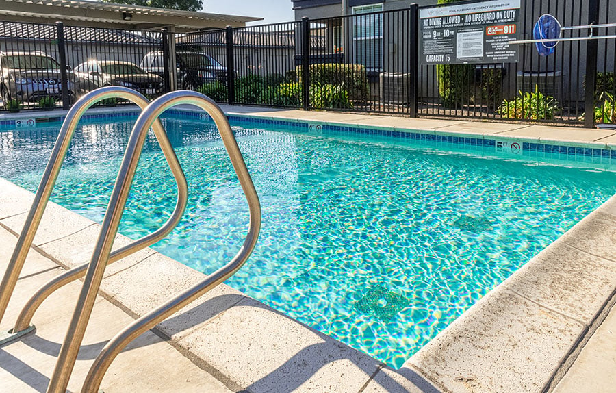A pool with a metal ladder.