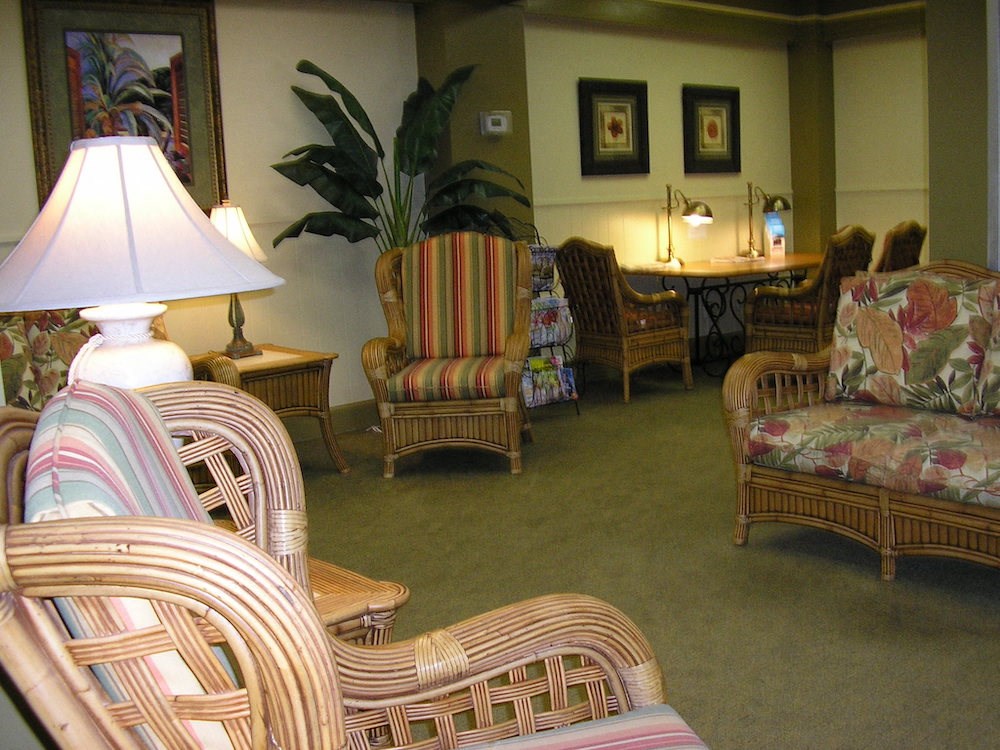 lobby with couches, chairs, lamps, and decor