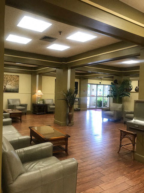 comfortable chairs, sofas, and coffee tables in main lobby