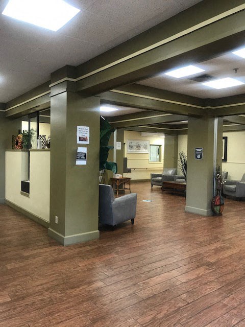 large lobby with hardwood style flooring and overhead lighting