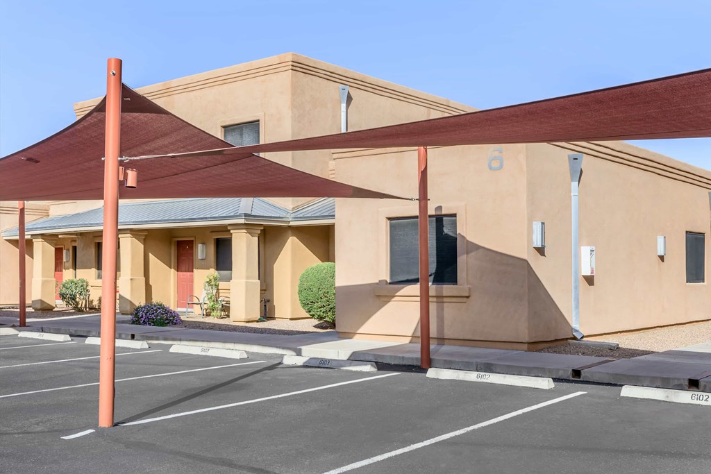 A building with a parking lot in front of it.